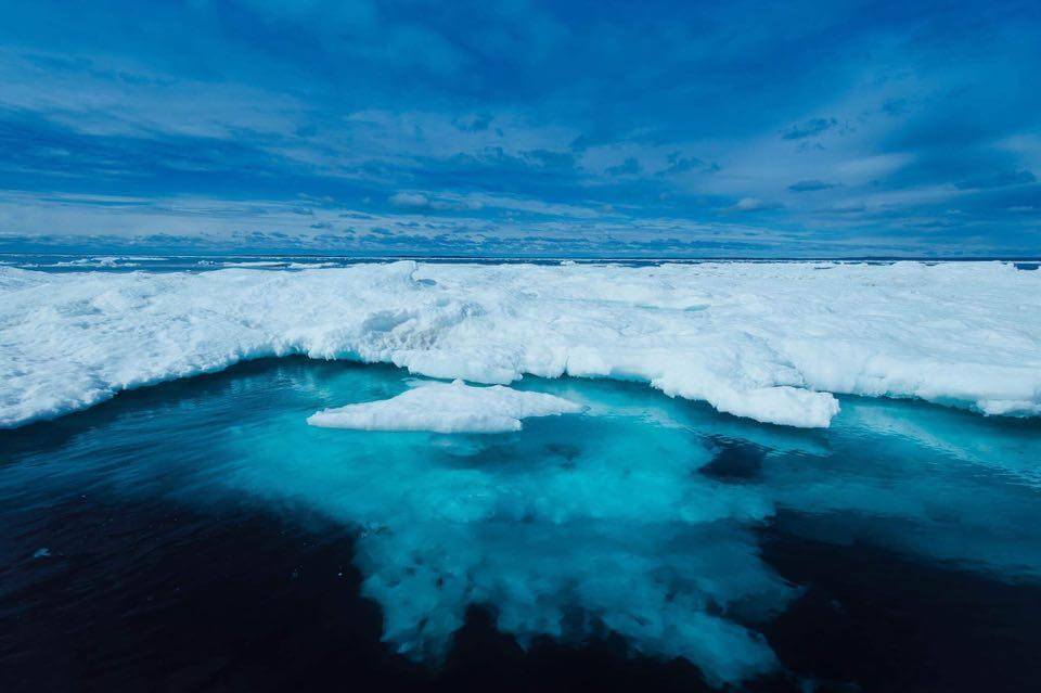 Iceberg, with the bottom visible through the clean, cold Arctic water